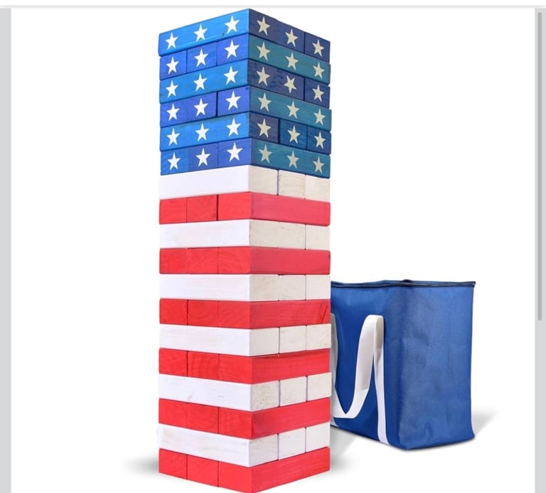 American flag-themed stacking tower game with blue storage bag next to it